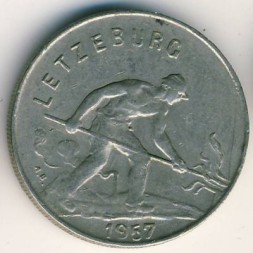 Монета Люксембург 1 франк 1957 год - Рабочий-пудлинговщик